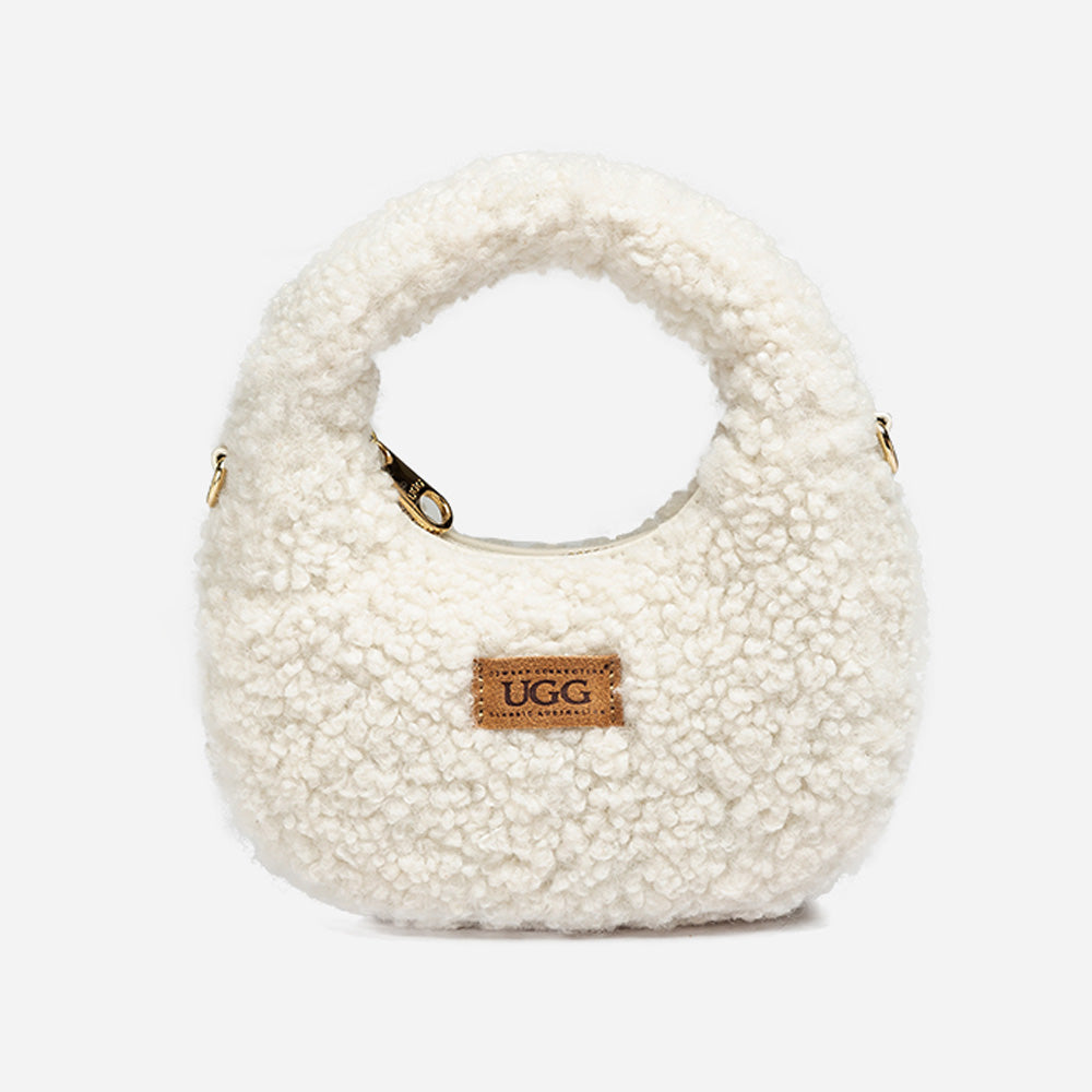 White shearling handbag with UGG logo on a white background